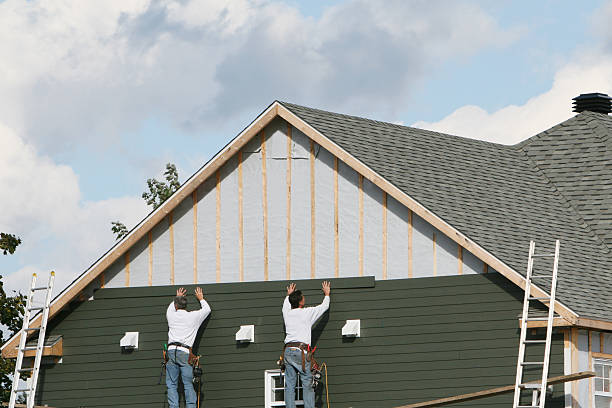 Professional Siding Installation technician working in Tewksbury, MA